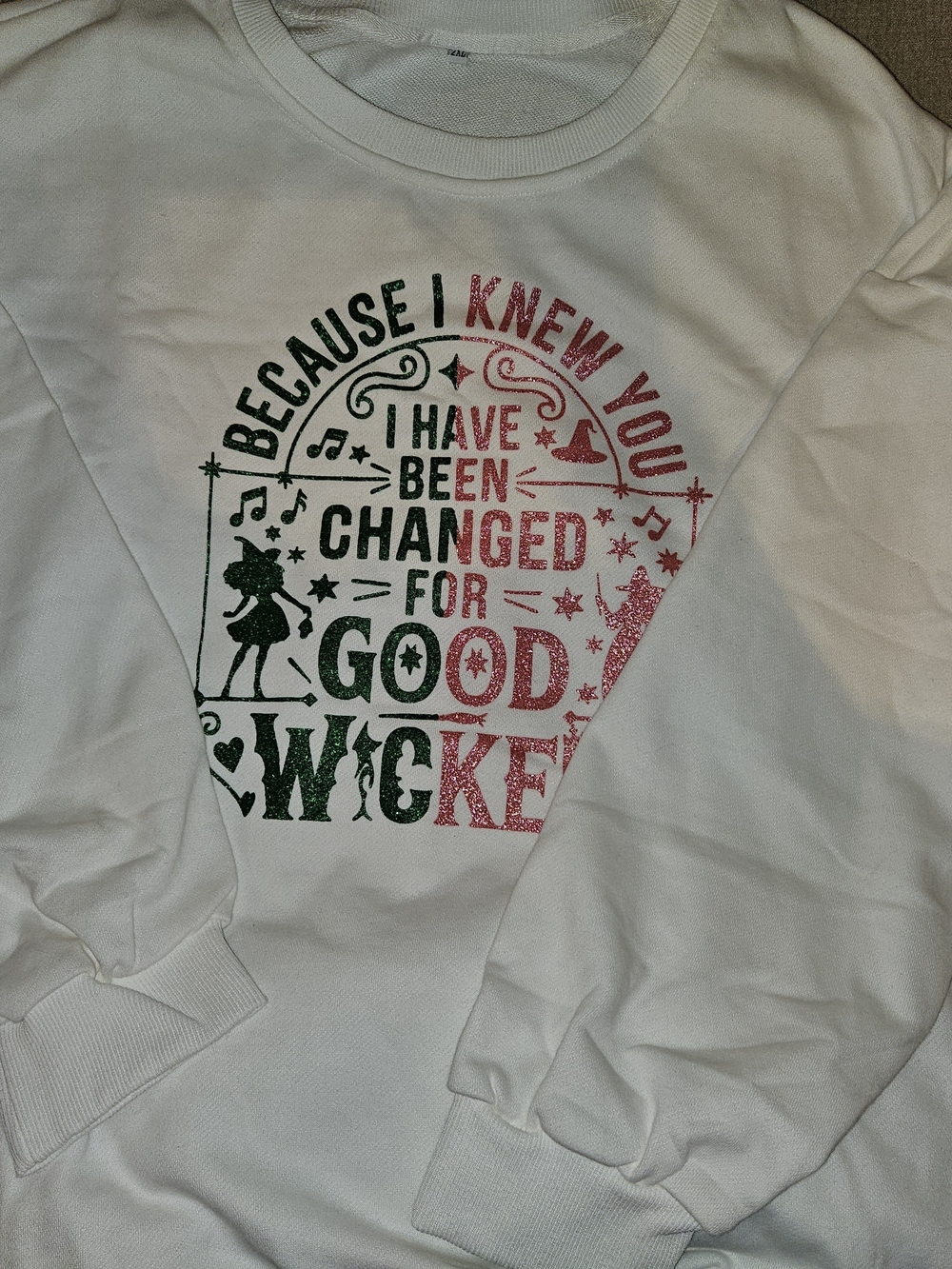 White Graphic Sweatshirt with Green and Pink Glitter Text